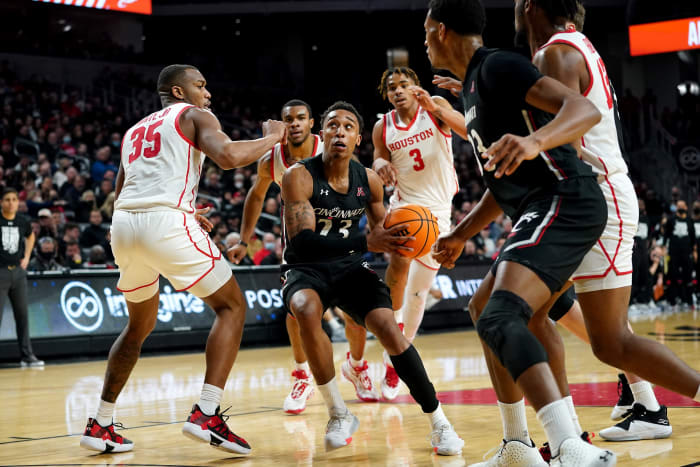 Cincinnati Bearcats guard Mika Adams-Woods (23) drives to the basket in the second half of an NCAA men s college basketball game against the Houston Cougars, Sunday, Feb. 6, 2022, at Fifth Third Arena in Cincinnati. The Houston Cougars defeated the Cincinnati Bearcats, 80-58. Houston Cougars At Cincinnati Bearcats Feb 7